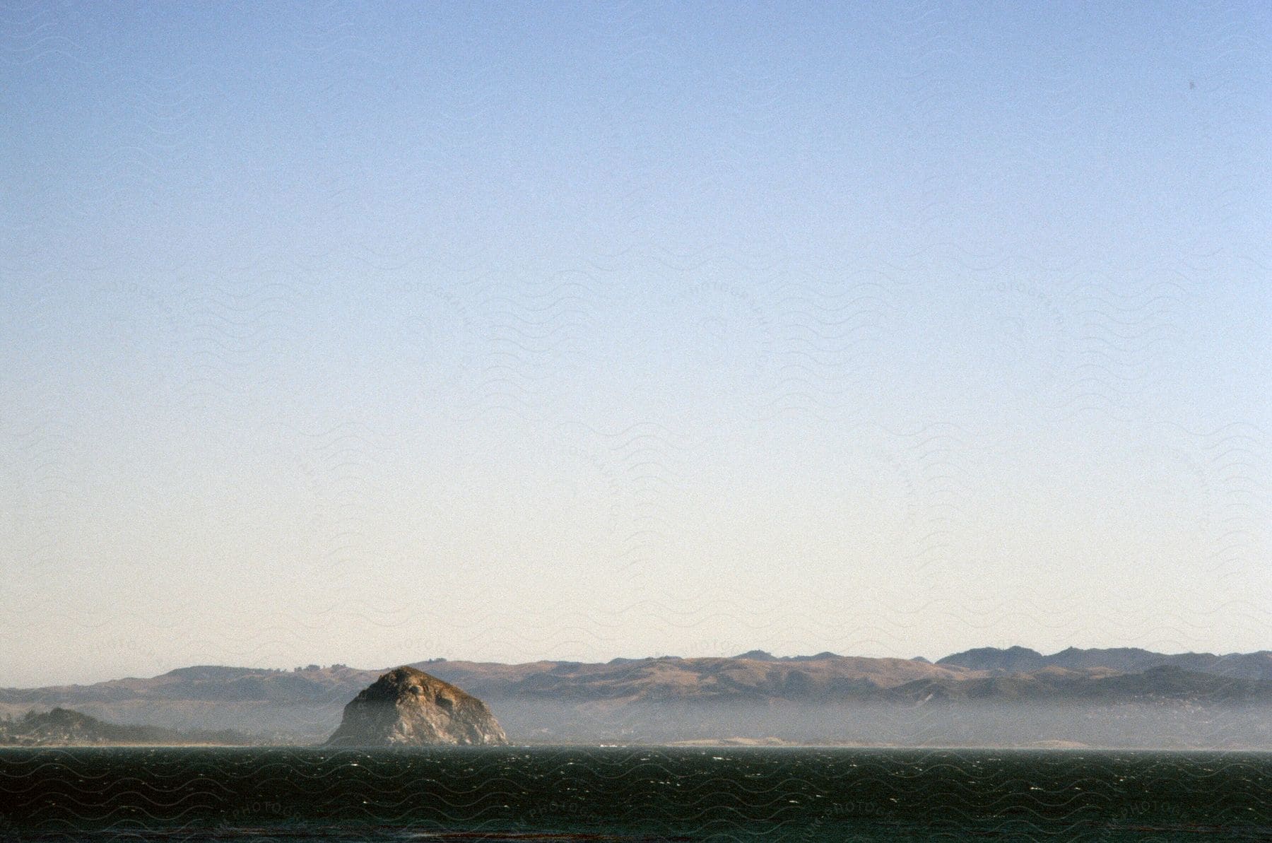 Dense clouds surround mountain peaks