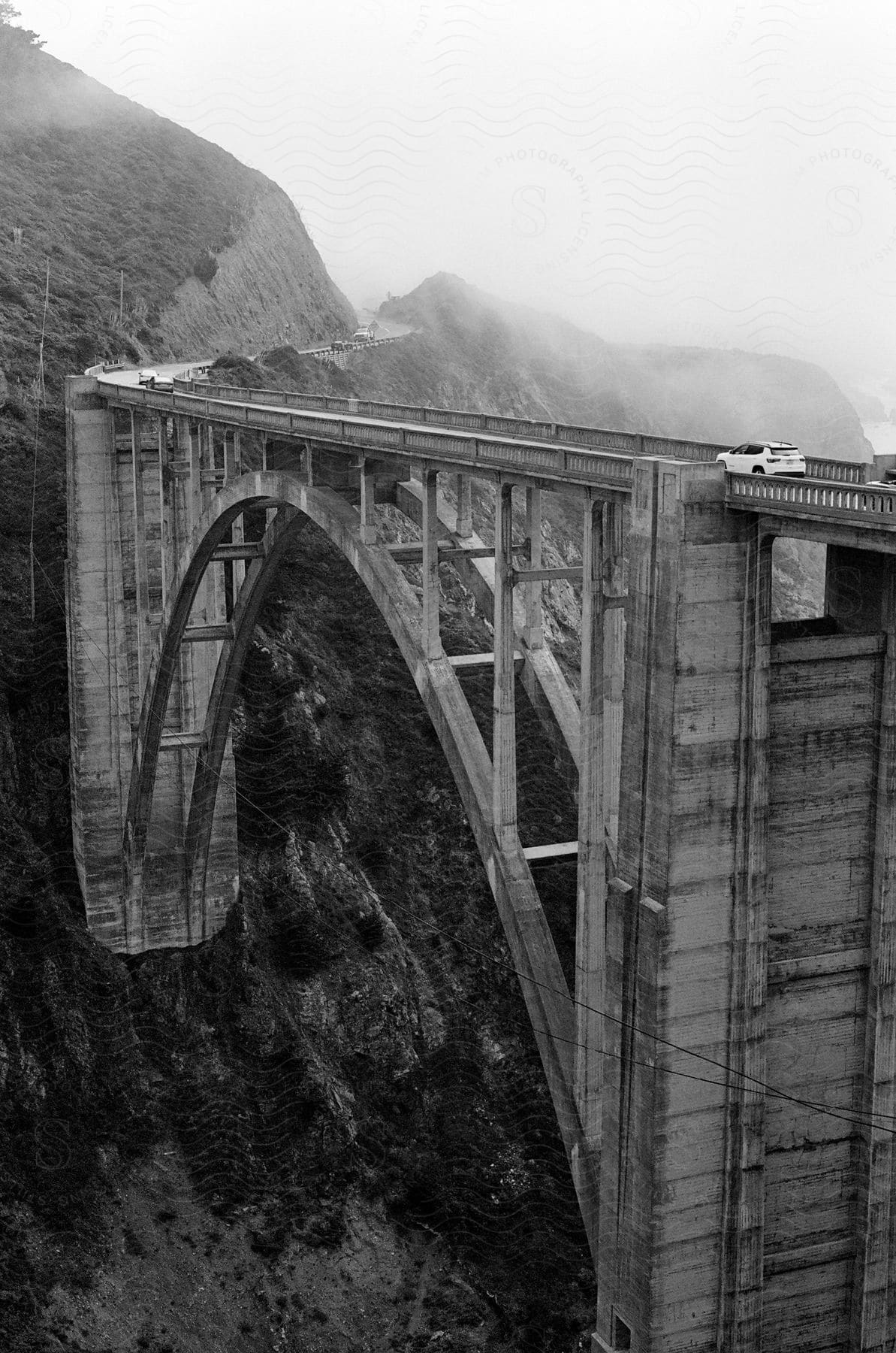 Cars driving across a bridge over a wide gorge