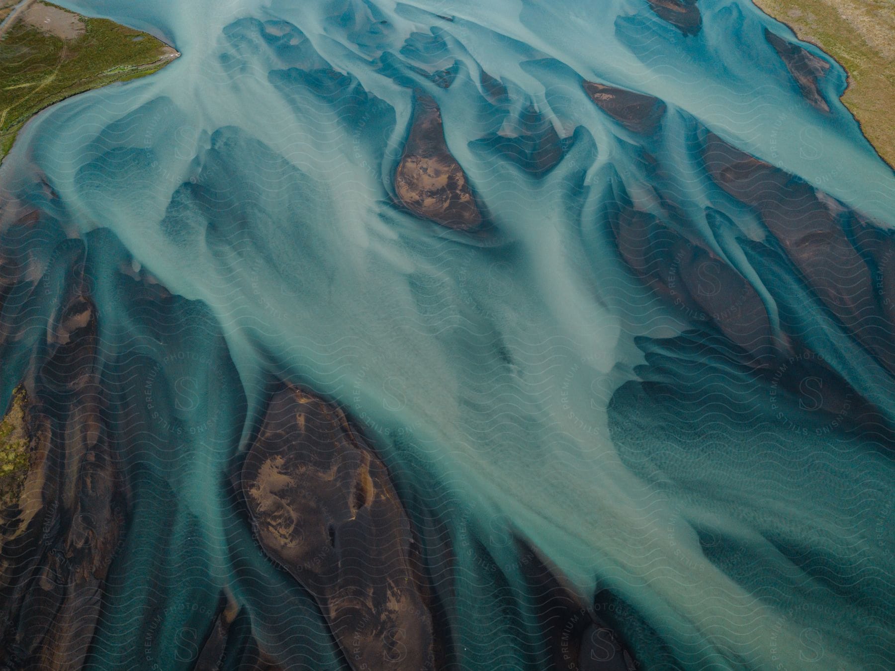 An art piece mimics a waterfall over rocks