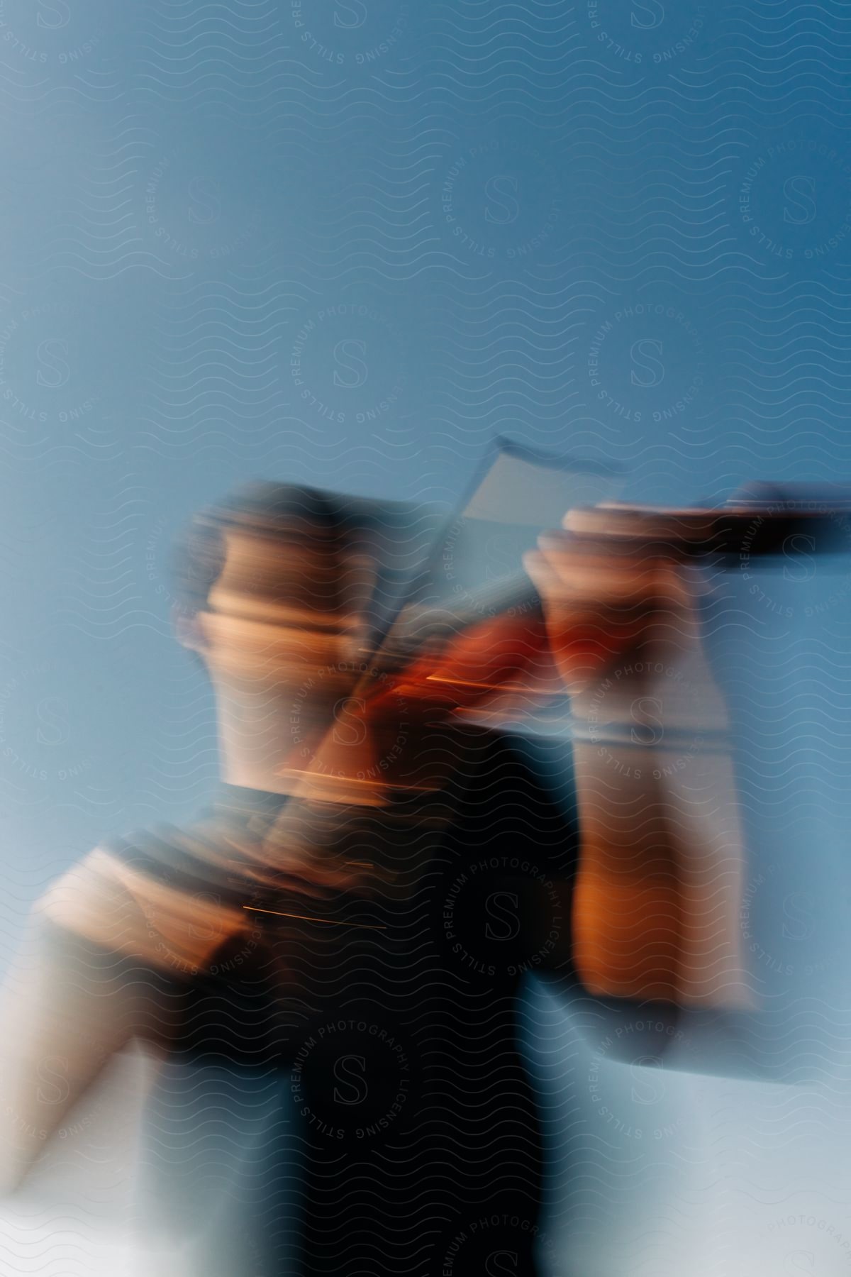 Stock photo of a man playing the violin with a blurred background