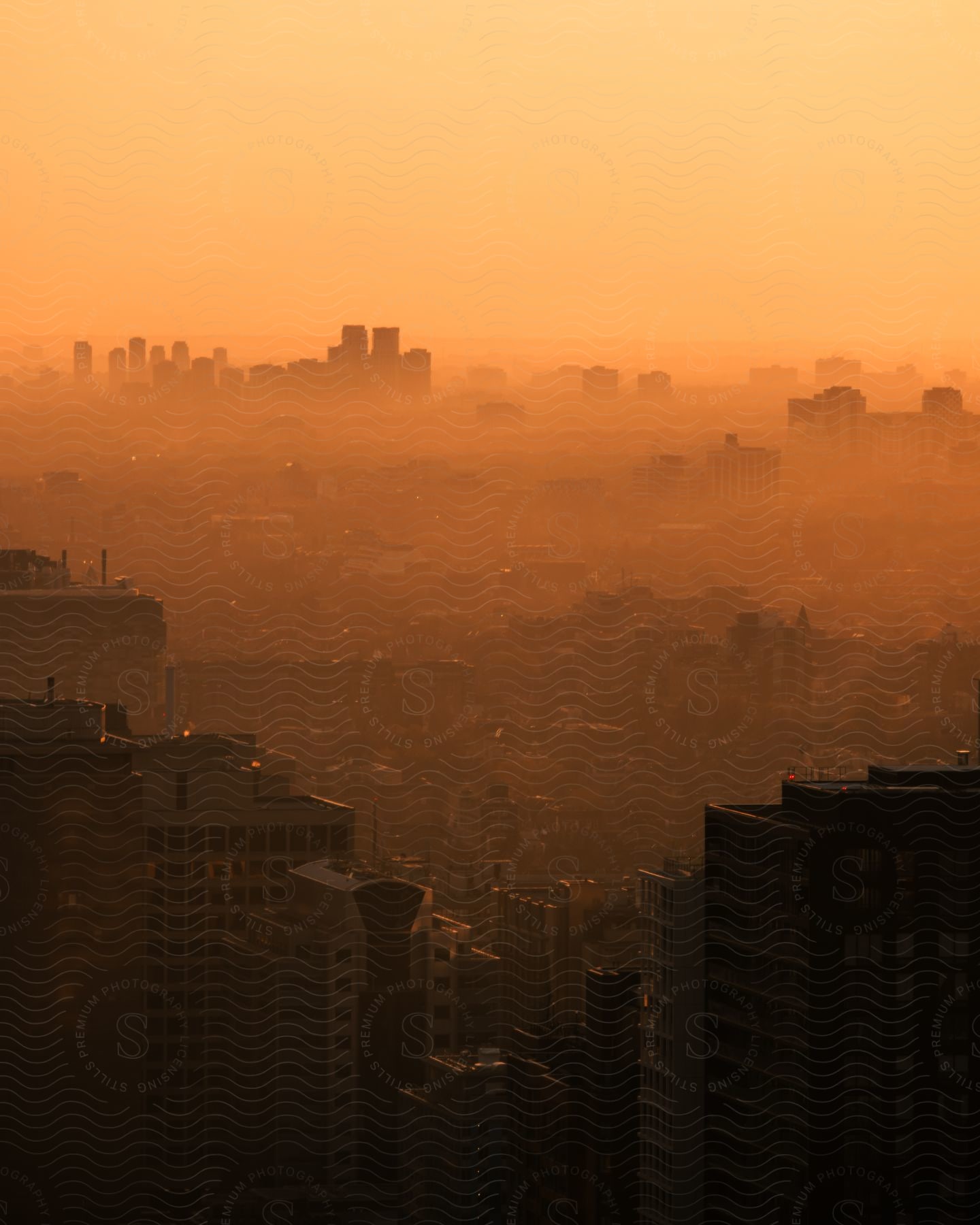 A city with pollution and clouds in the sky