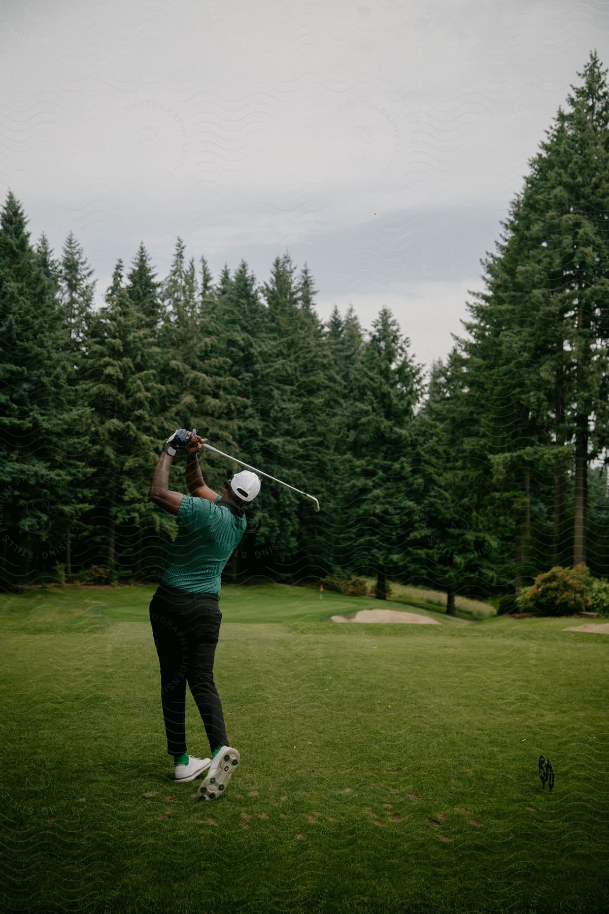 A man playing golf on a golf course