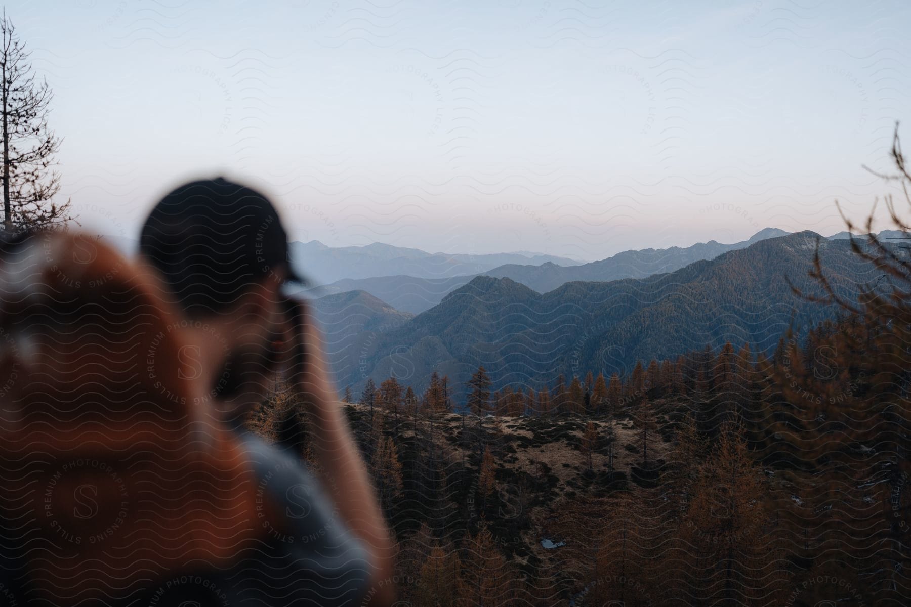 Stock photo of hiker takes picture of foggy mountain range.