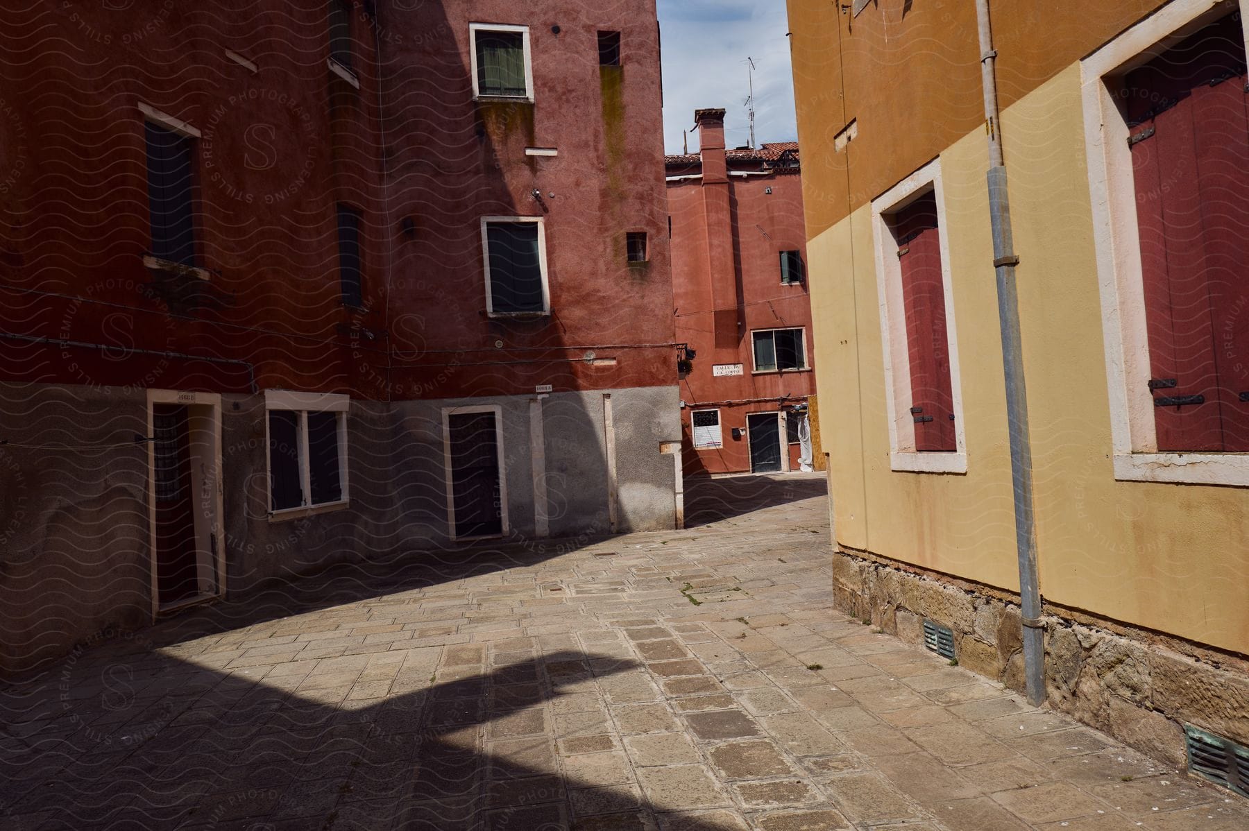 Bricks Cover An Alley Between Abandoned Buildings