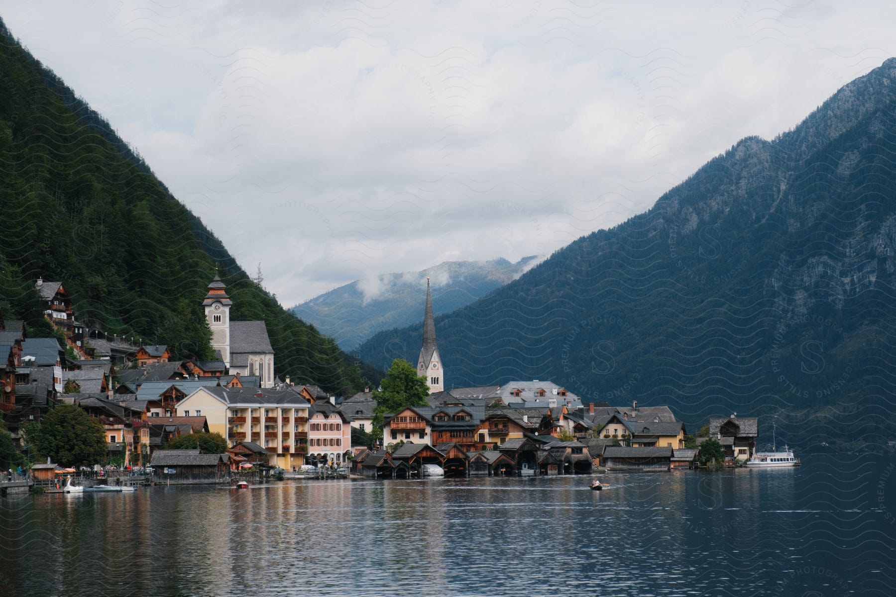 A costal town near a mountain and body of water.