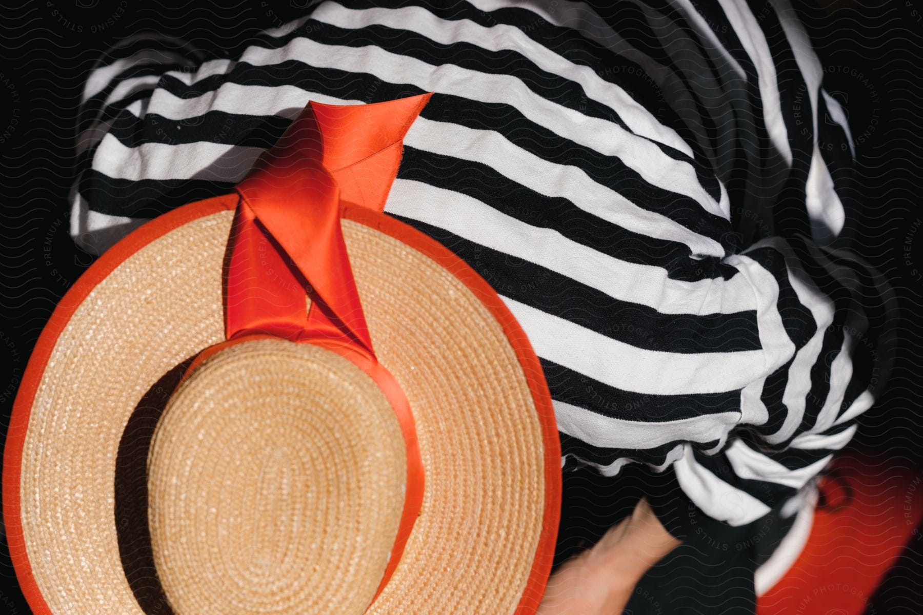 Lola hat with orange accents.