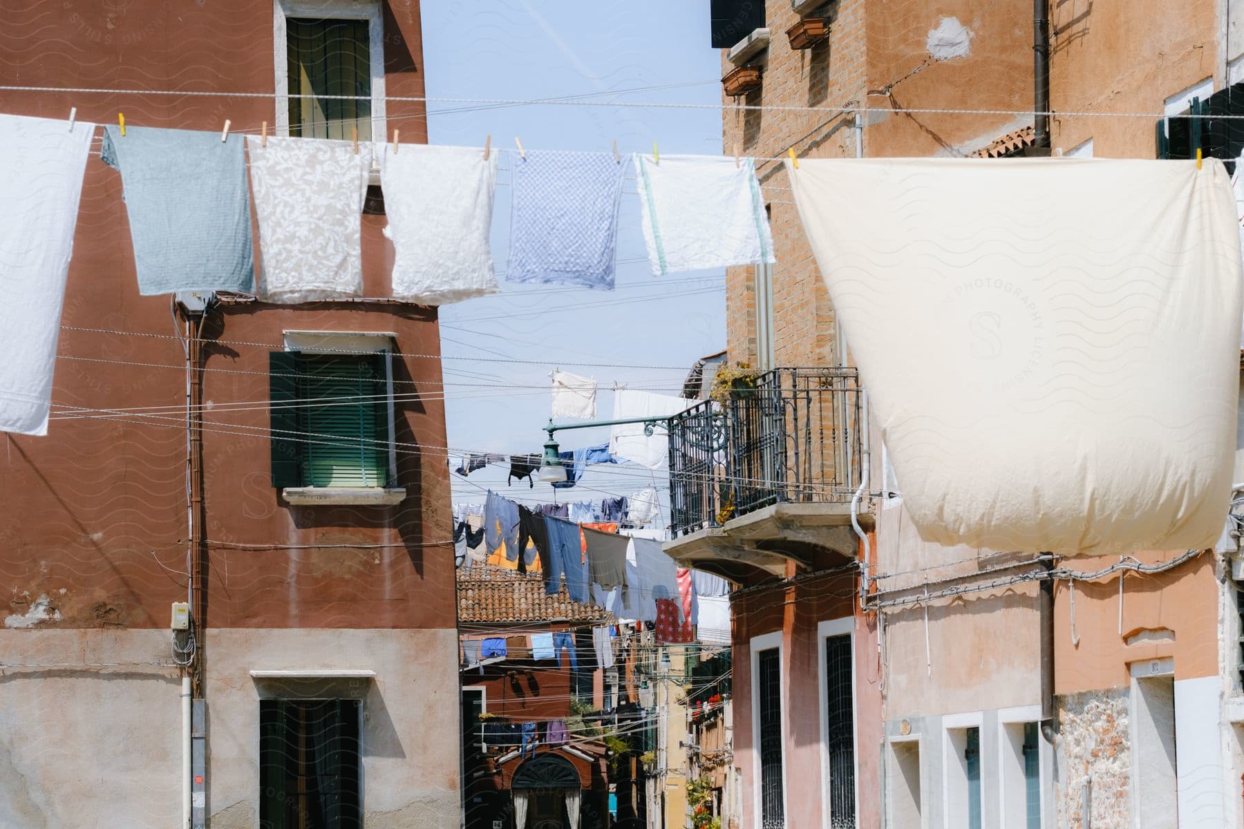 Clothes hanging on clotheslines between different buildings