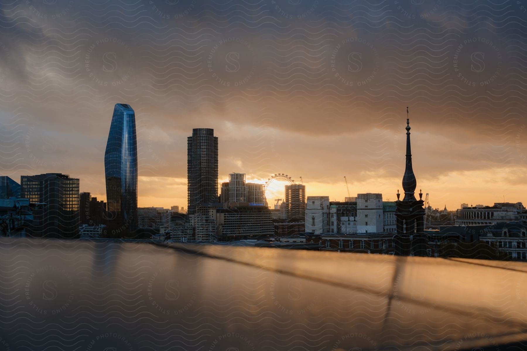 Seaside metropolis skyline with skyscrapers at sunset.