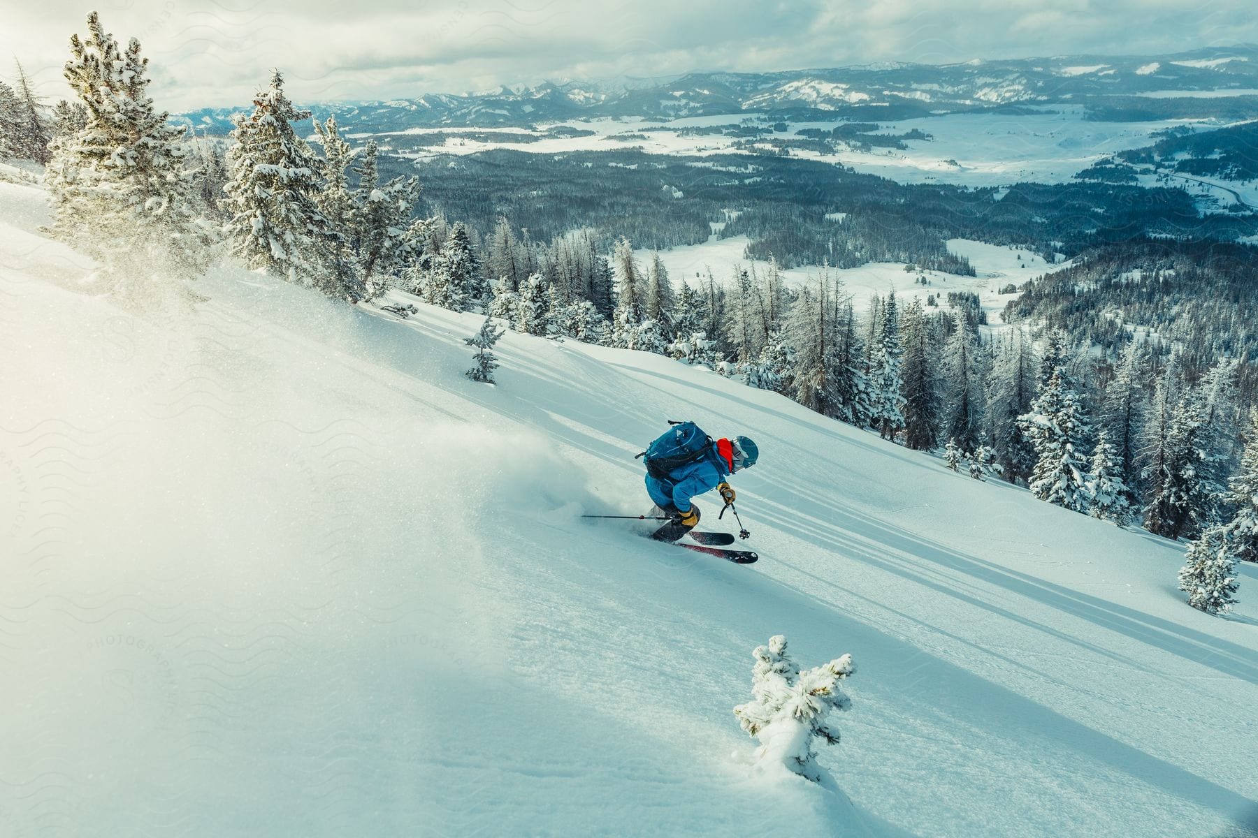 A Skier Rides Down The Side Of A Mountain