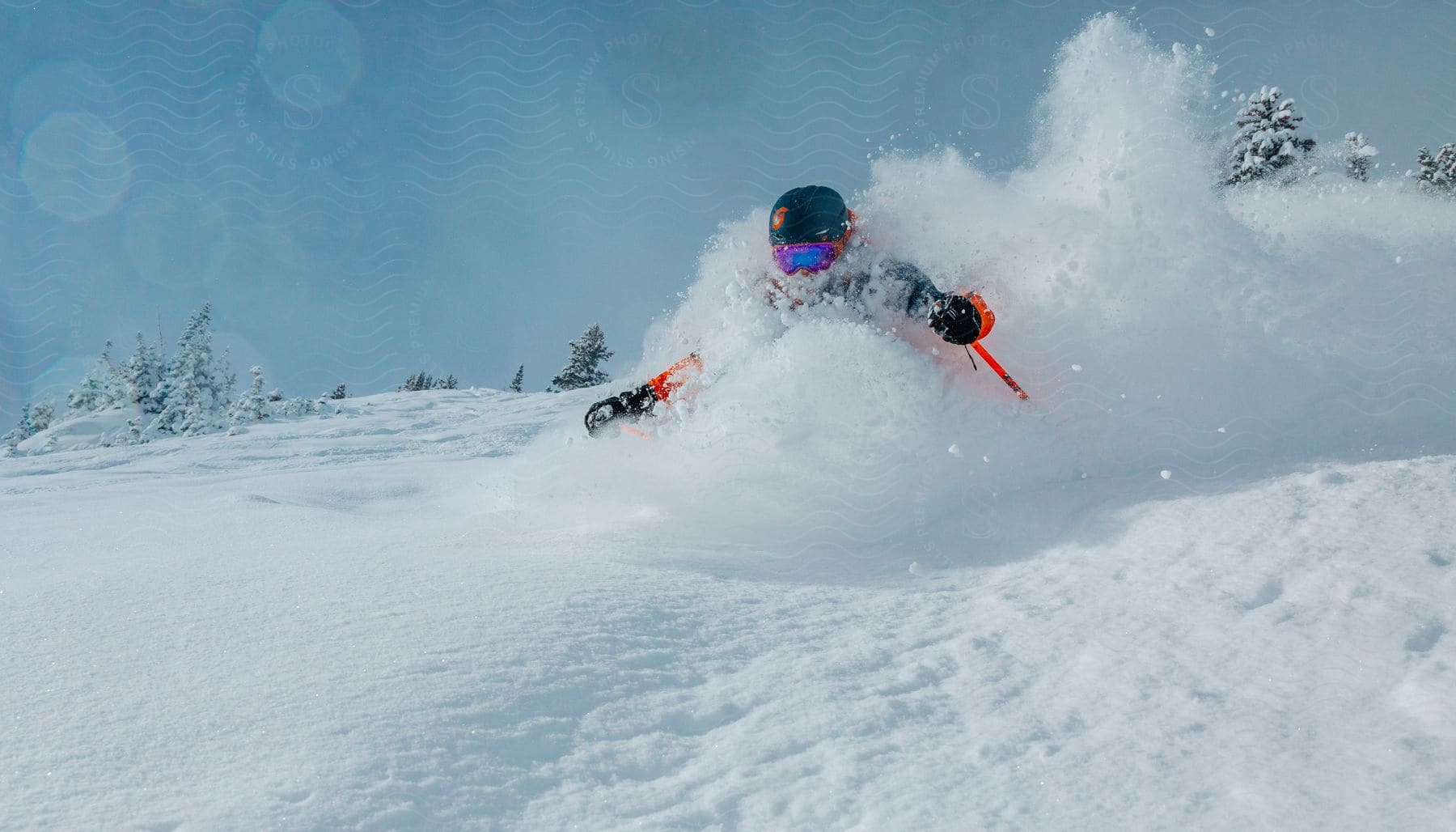 a person wearing red jacket and helmet in the winter sliding down the hill on a ski