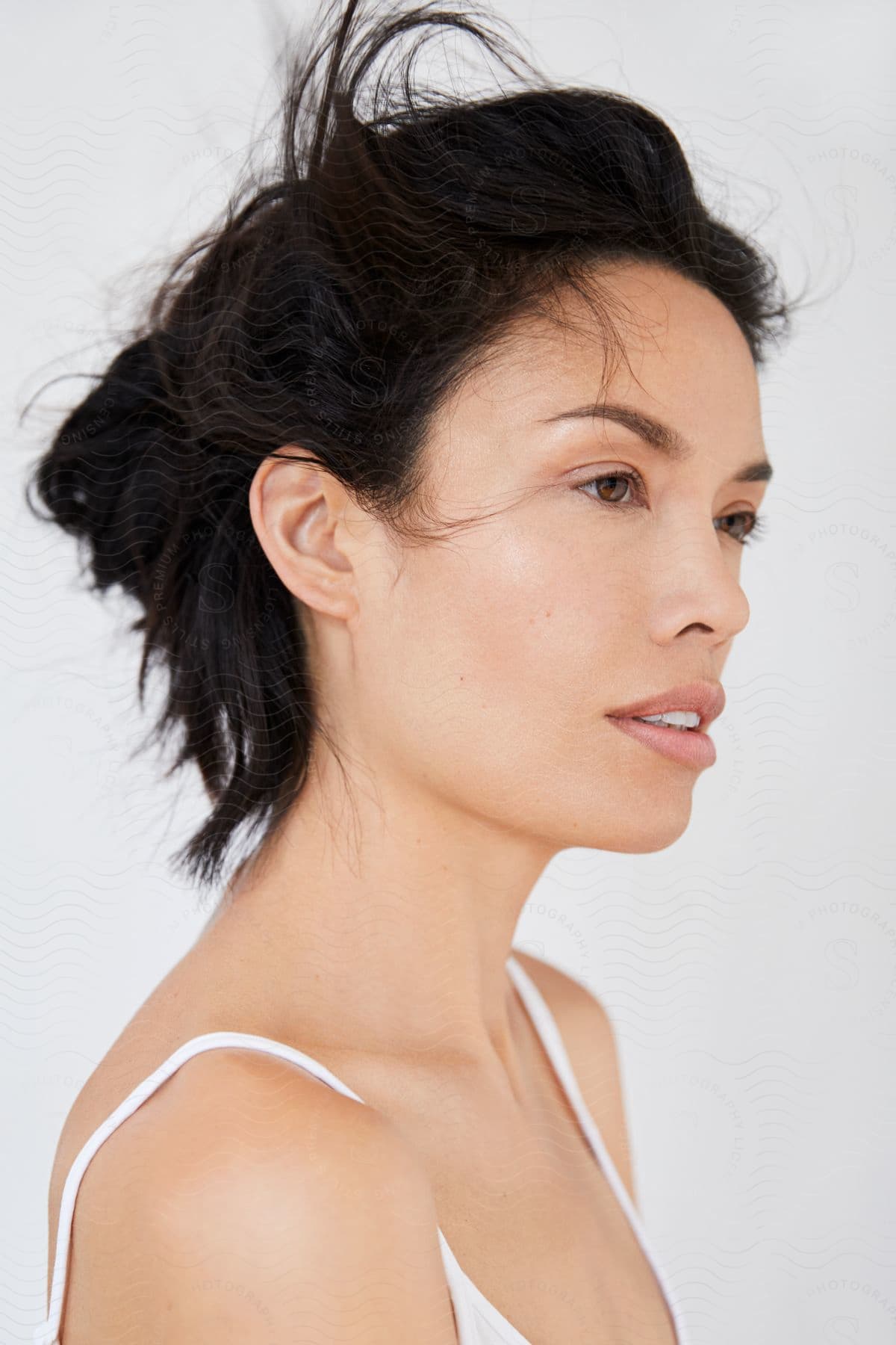 A portrait of a woman with short hair looking straight.