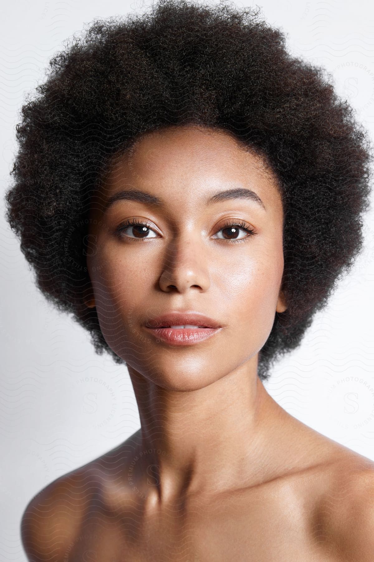 Black woman portrait with afro hair.