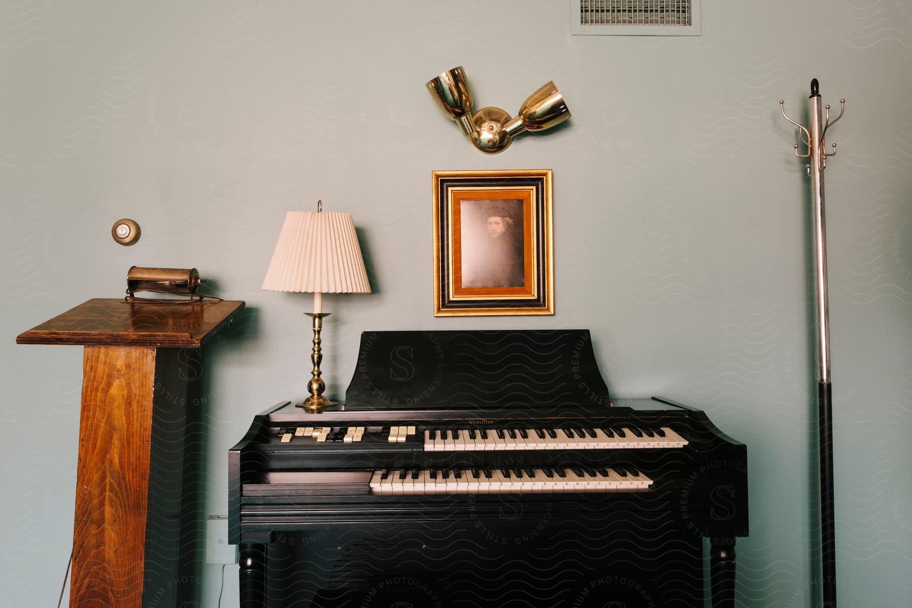 Living room with piano and lamp.