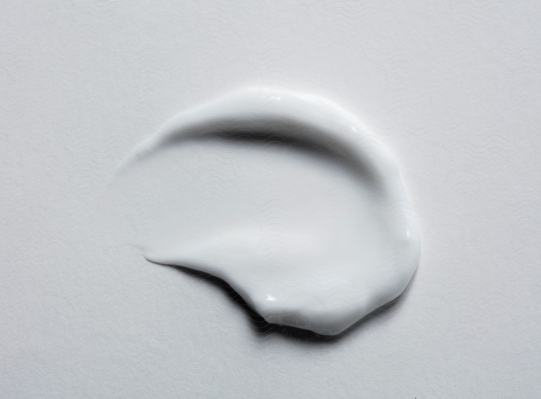 Modern art in white liquid ink.