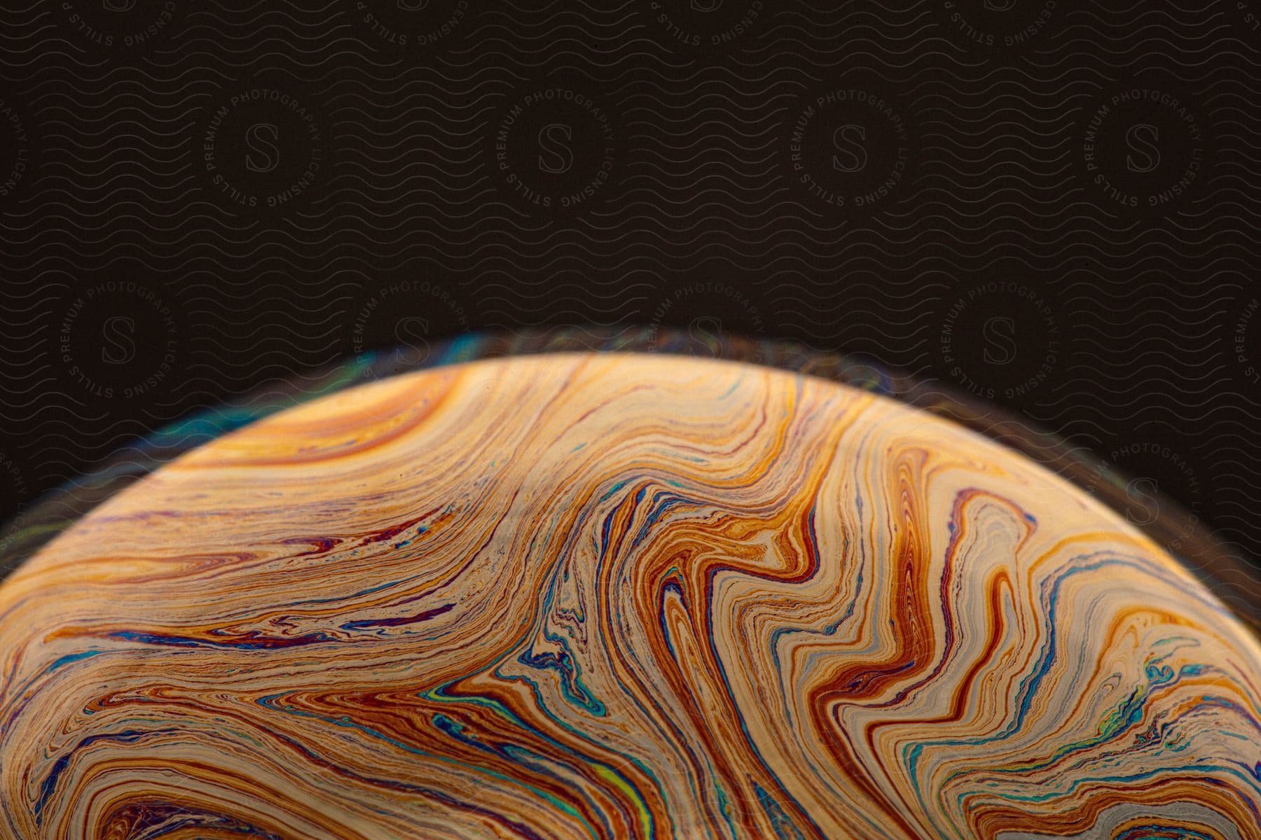 Planet with colored lines and liquid.