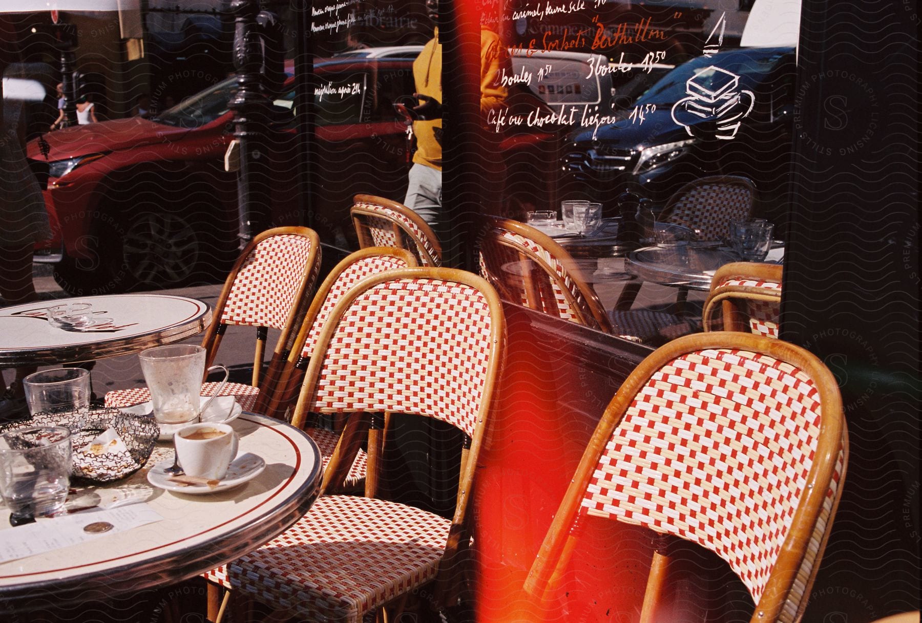 Outdoor table with empty cafe chicares.