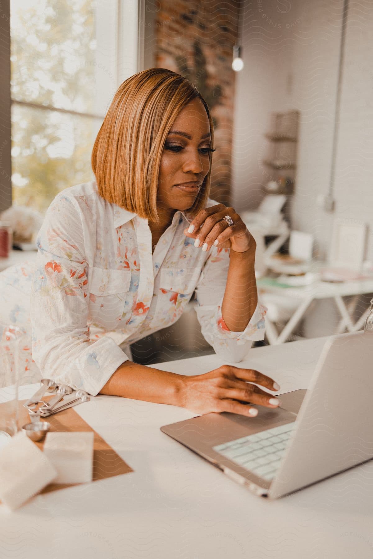 Stock photo of a woman works on her laptop in the office