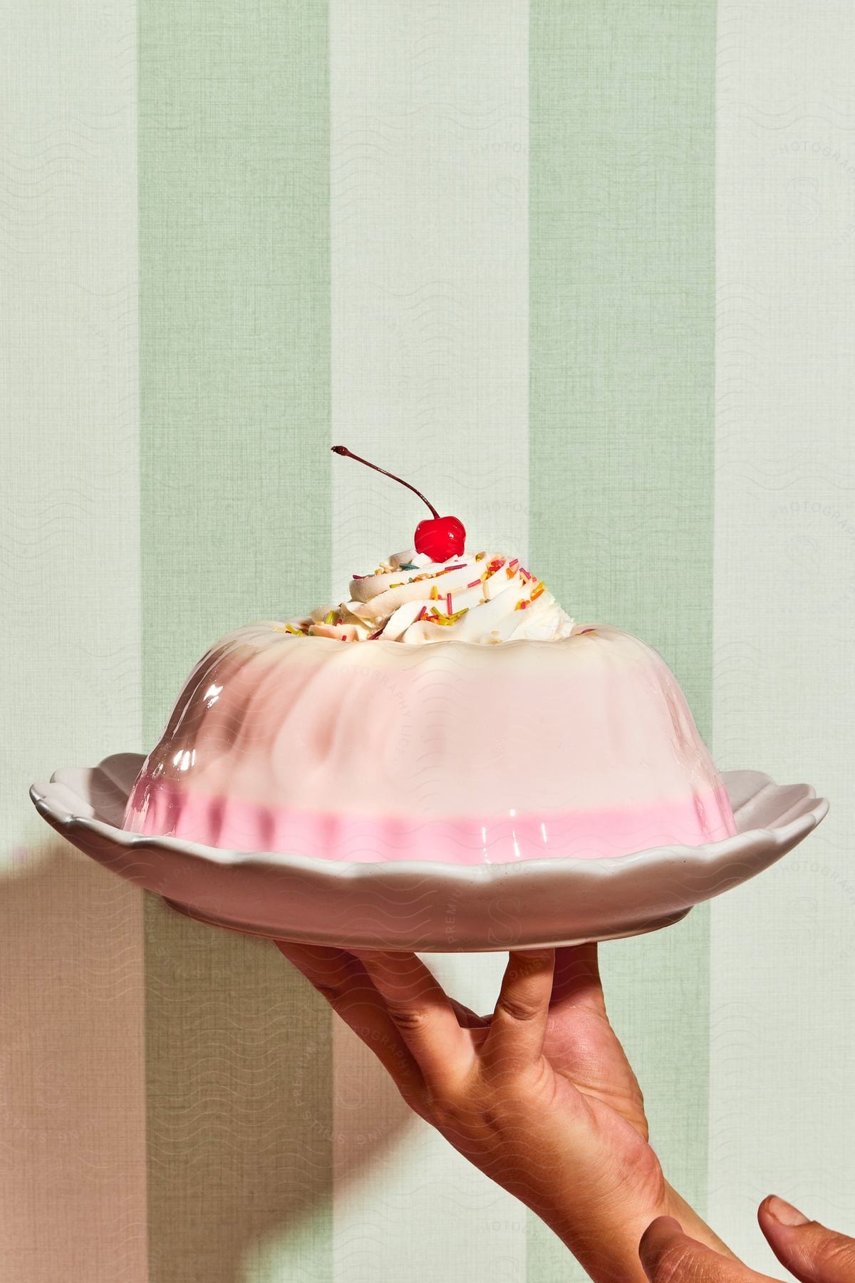 Woman carry a cake placed in a plate in one hand