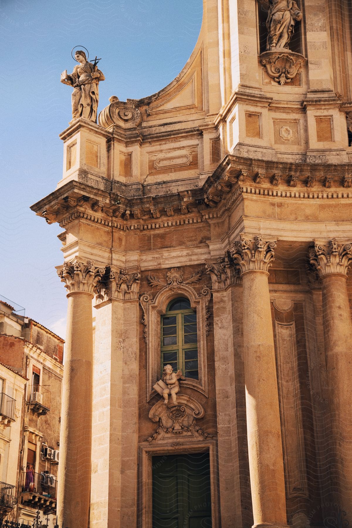 a church with designs in a city during the daytime