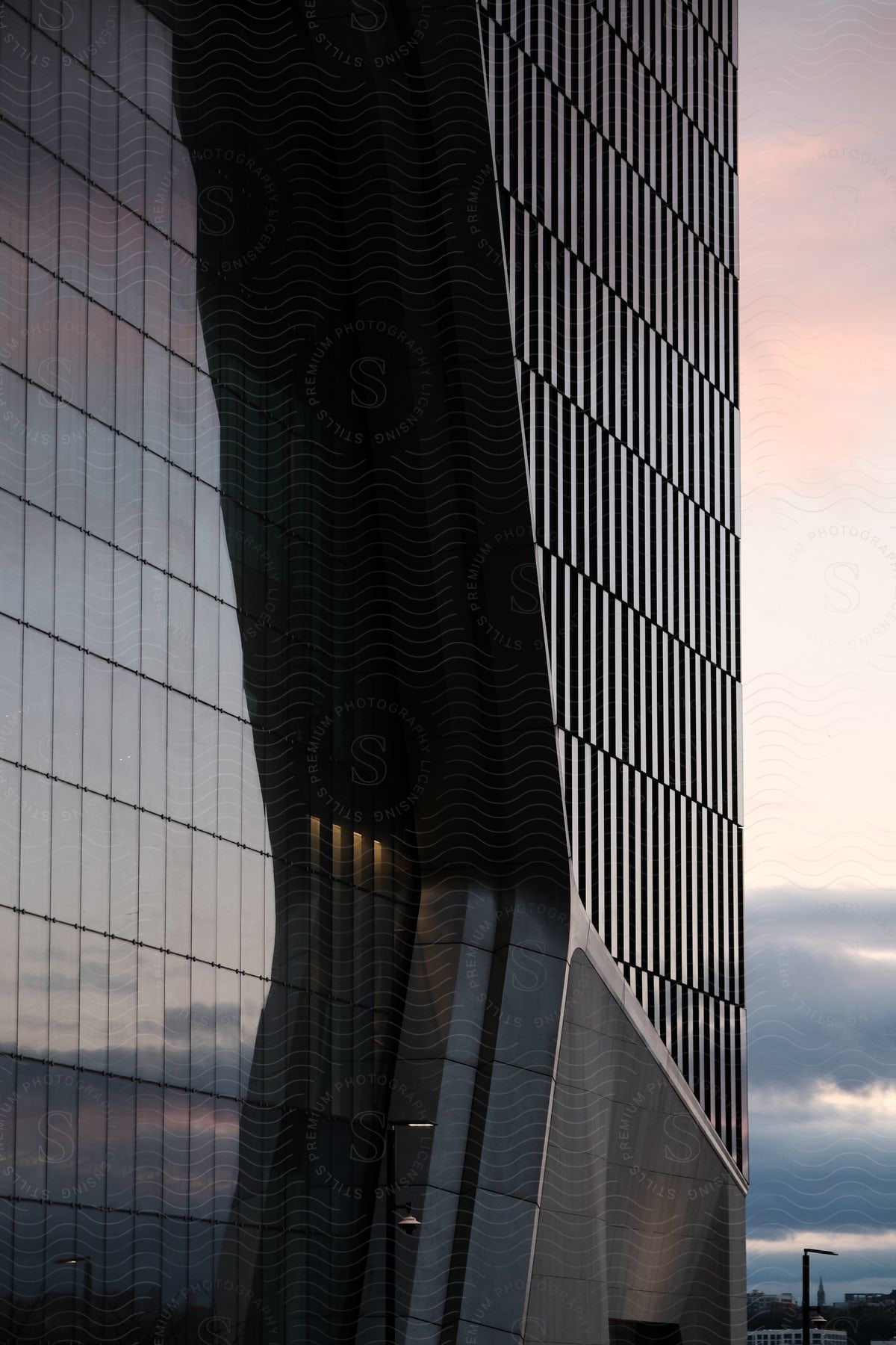 Sunset sky reflected on the facade of a skyscraper