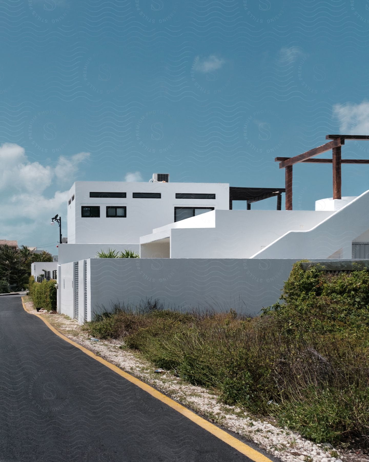 White Buildings With Unique Architecture Sit On The Roadside