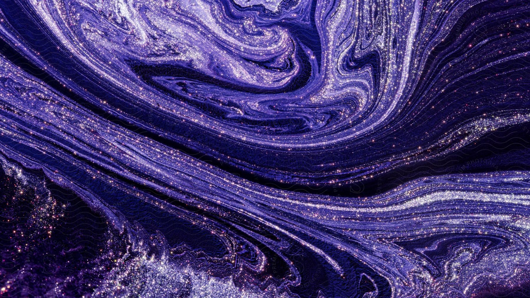 Swirling purple and gold fluid