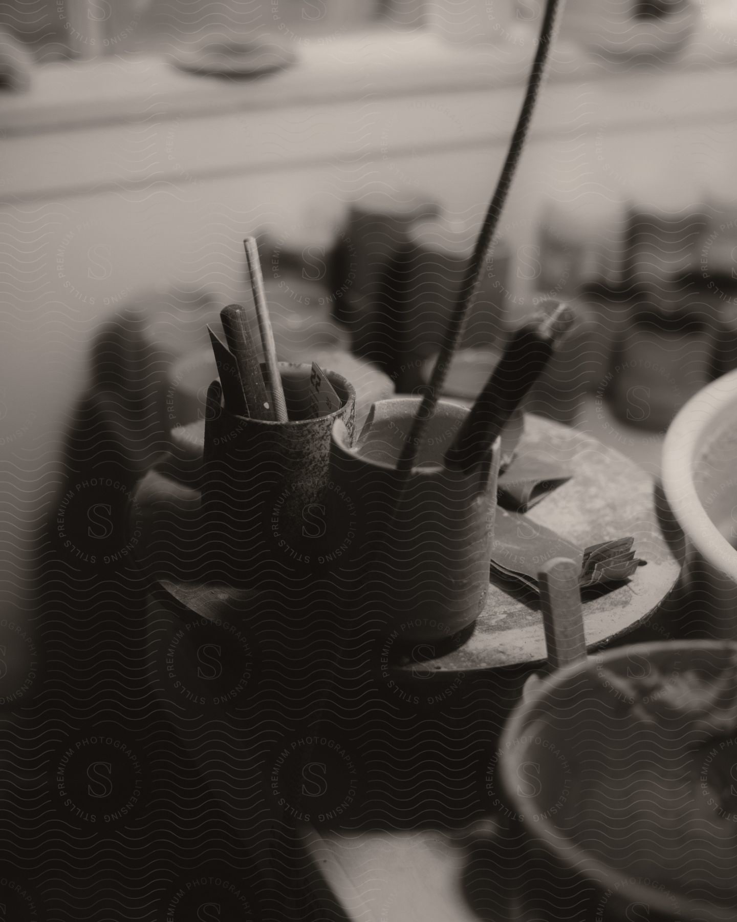 Close-up of paint supplies on a table.