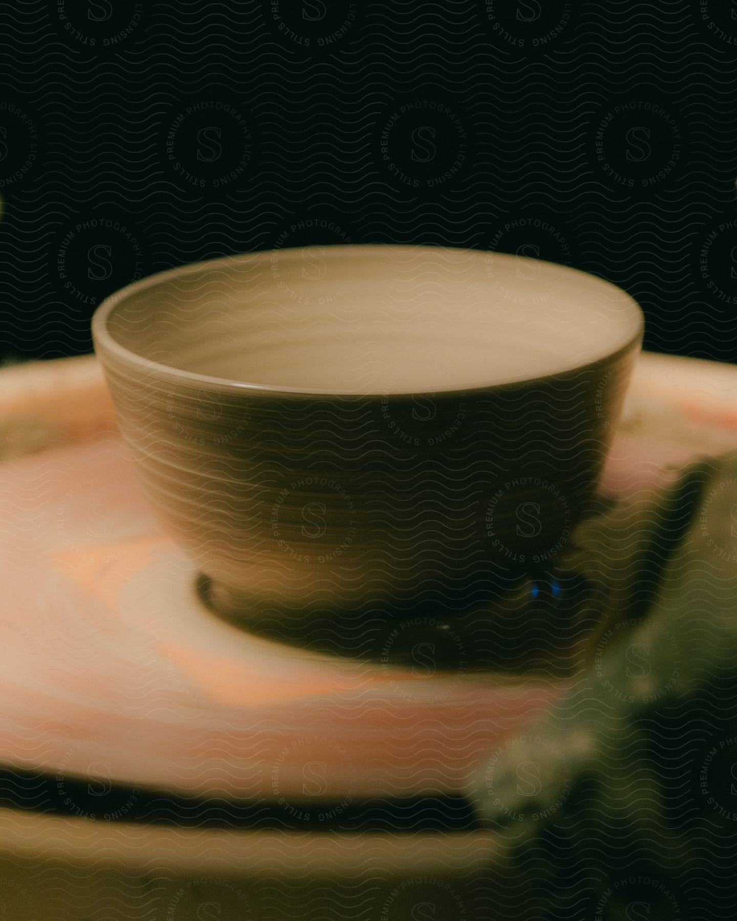 A freshly made pottery bowl drying.