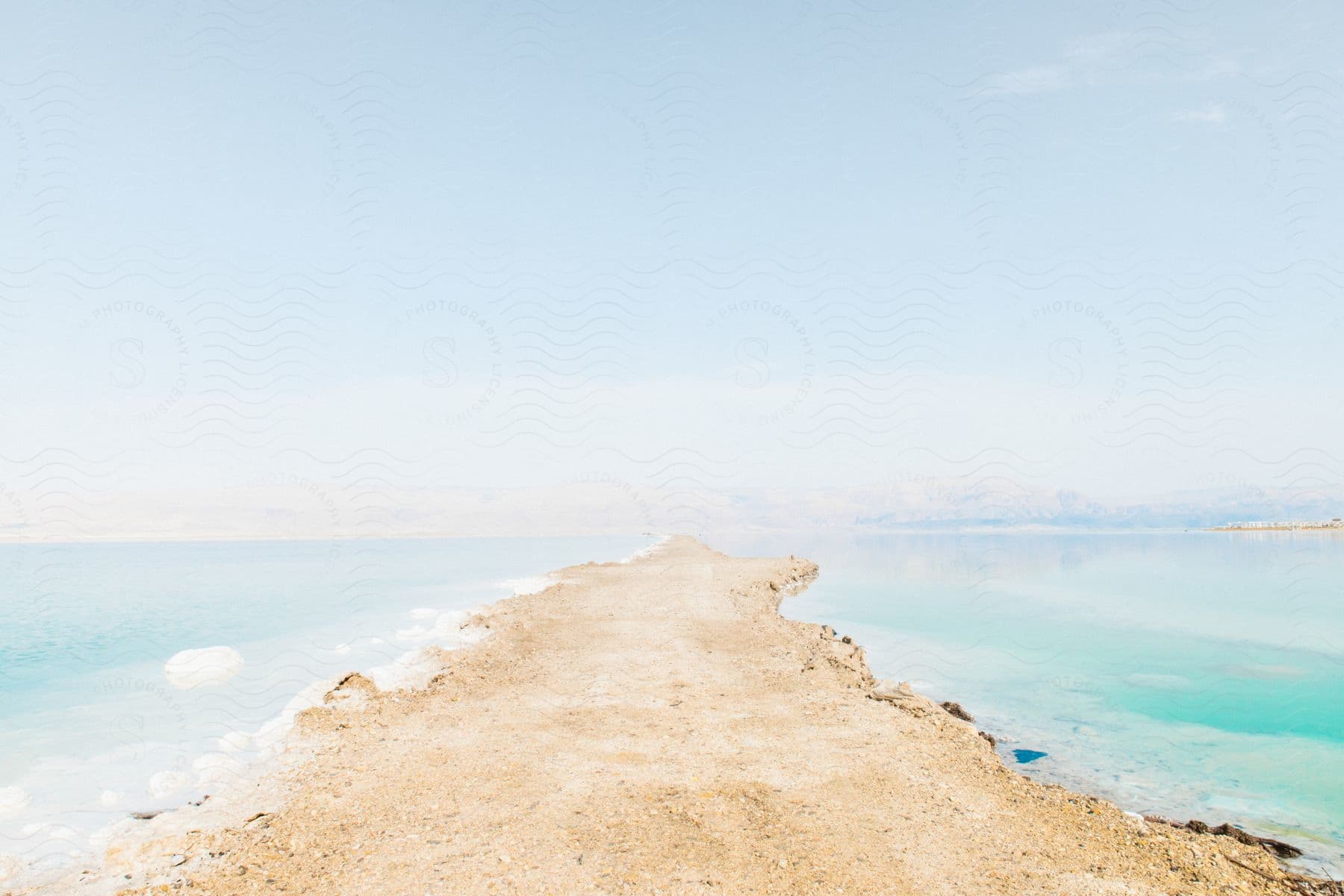 A dirt road separating the sea.