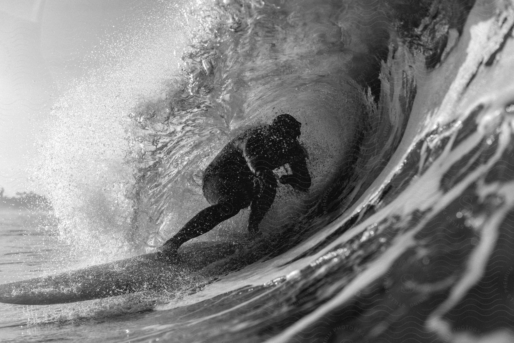 A surfer is surfing a large wave.