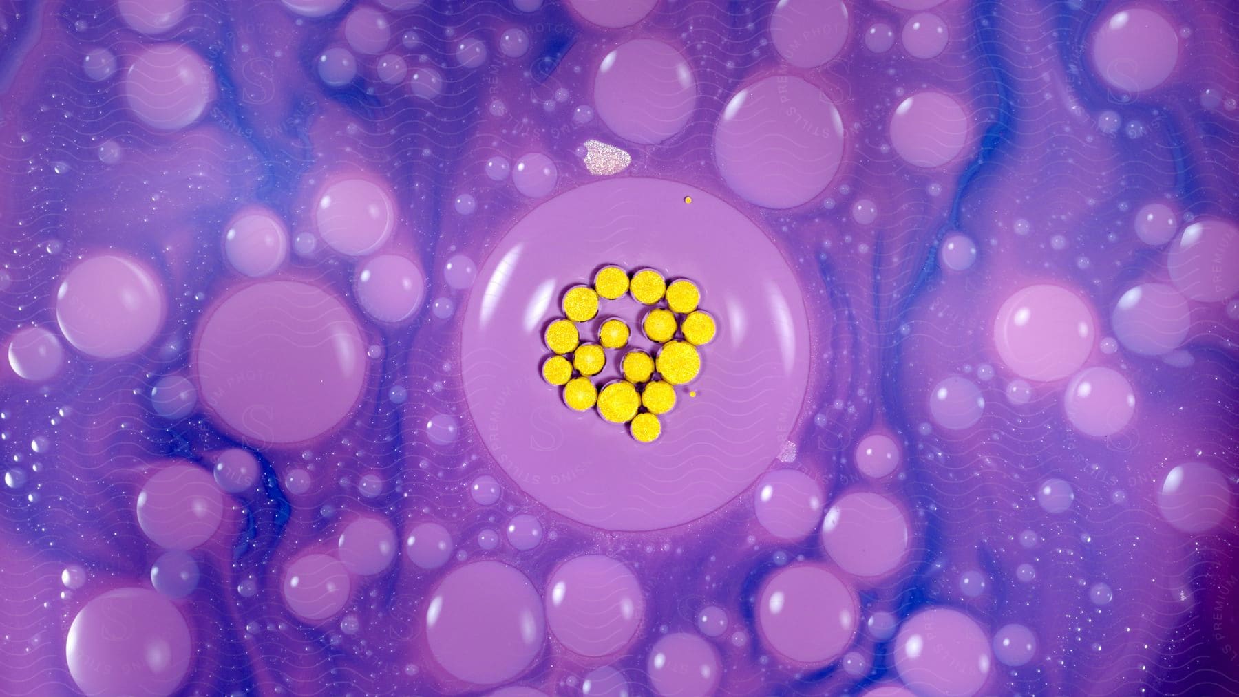 Stock photo of close up of abstract purple circles with tiny yellow spots