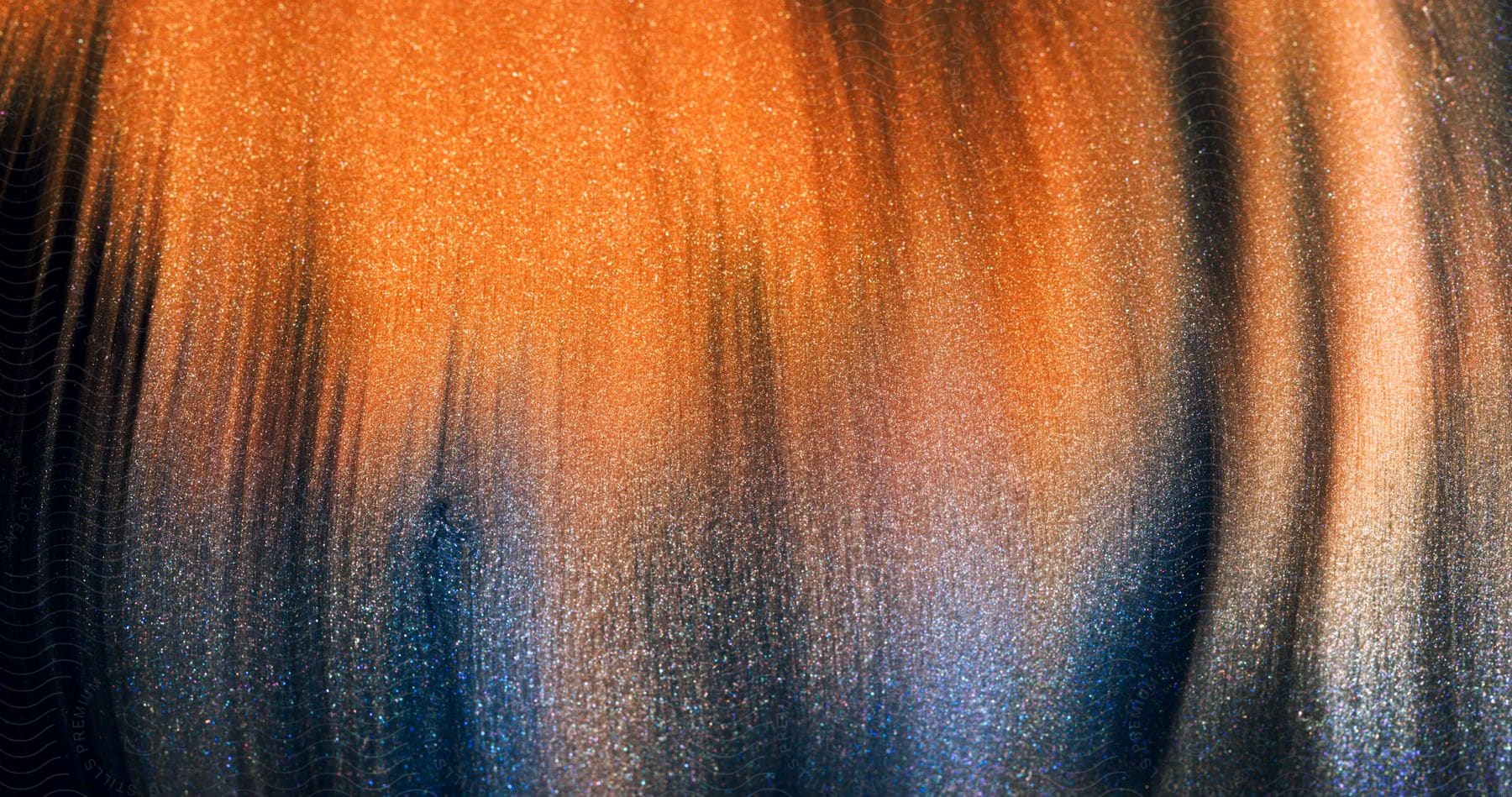 Close-up of abstract orange fluid painting