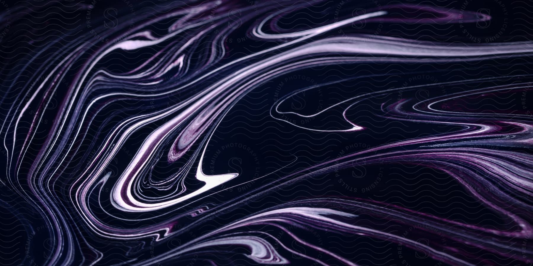 Flowing dark liquid reflecting blue and purple light.