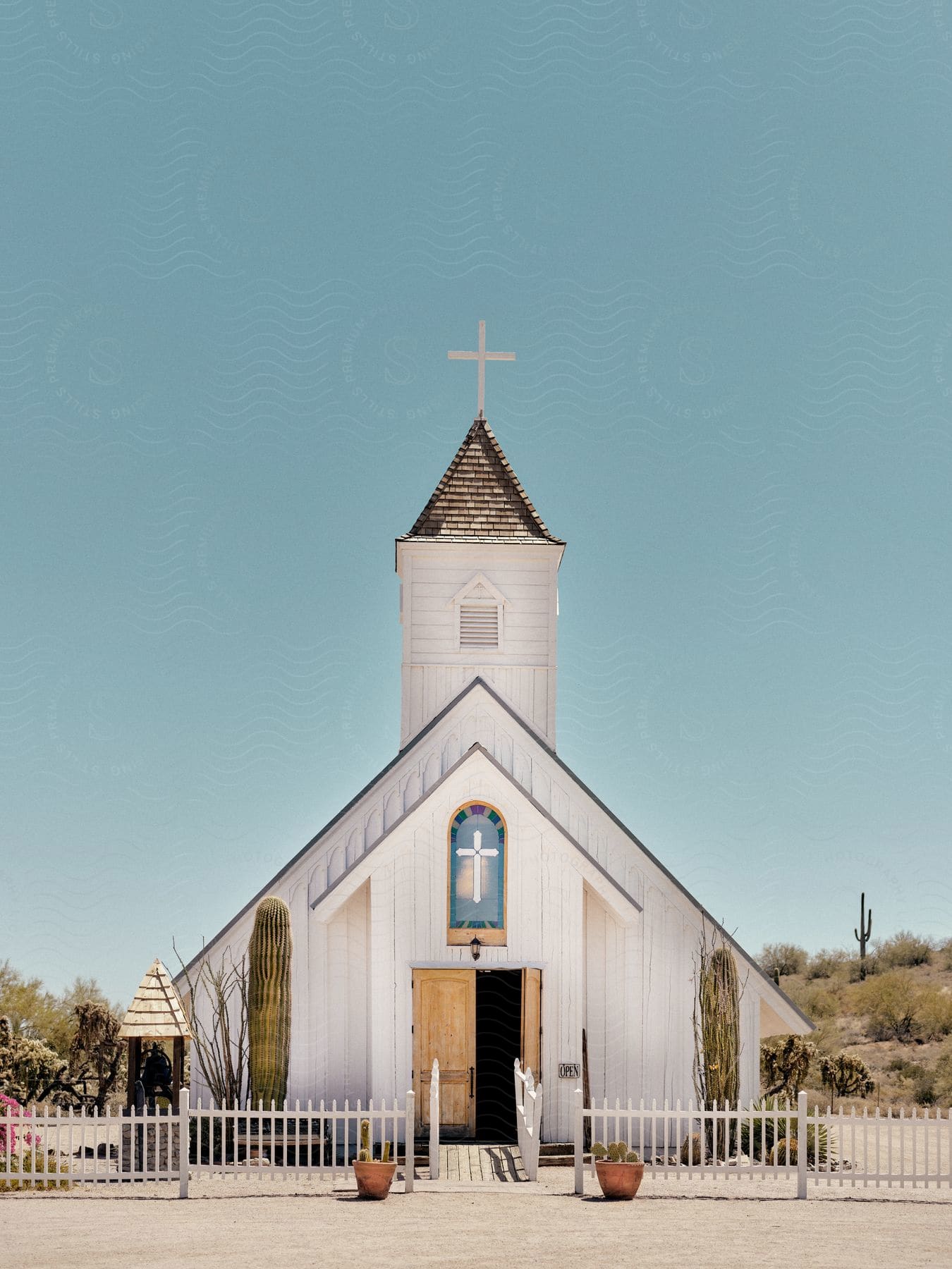 A wooden church building in the desert.