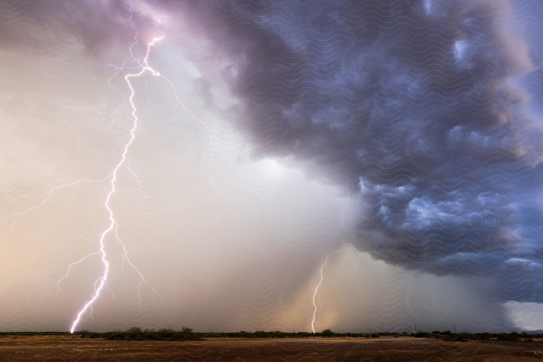 A lightning storm over a grass plain.