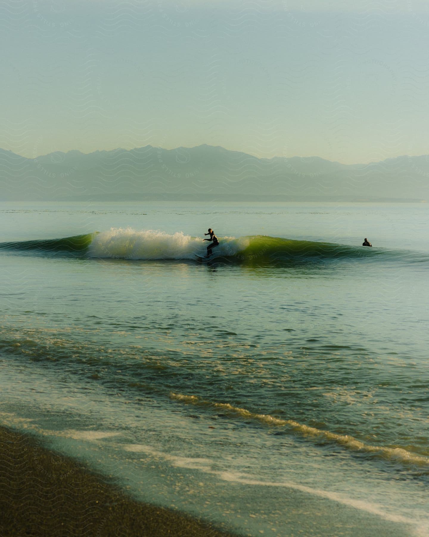 Person surfing a small wave.