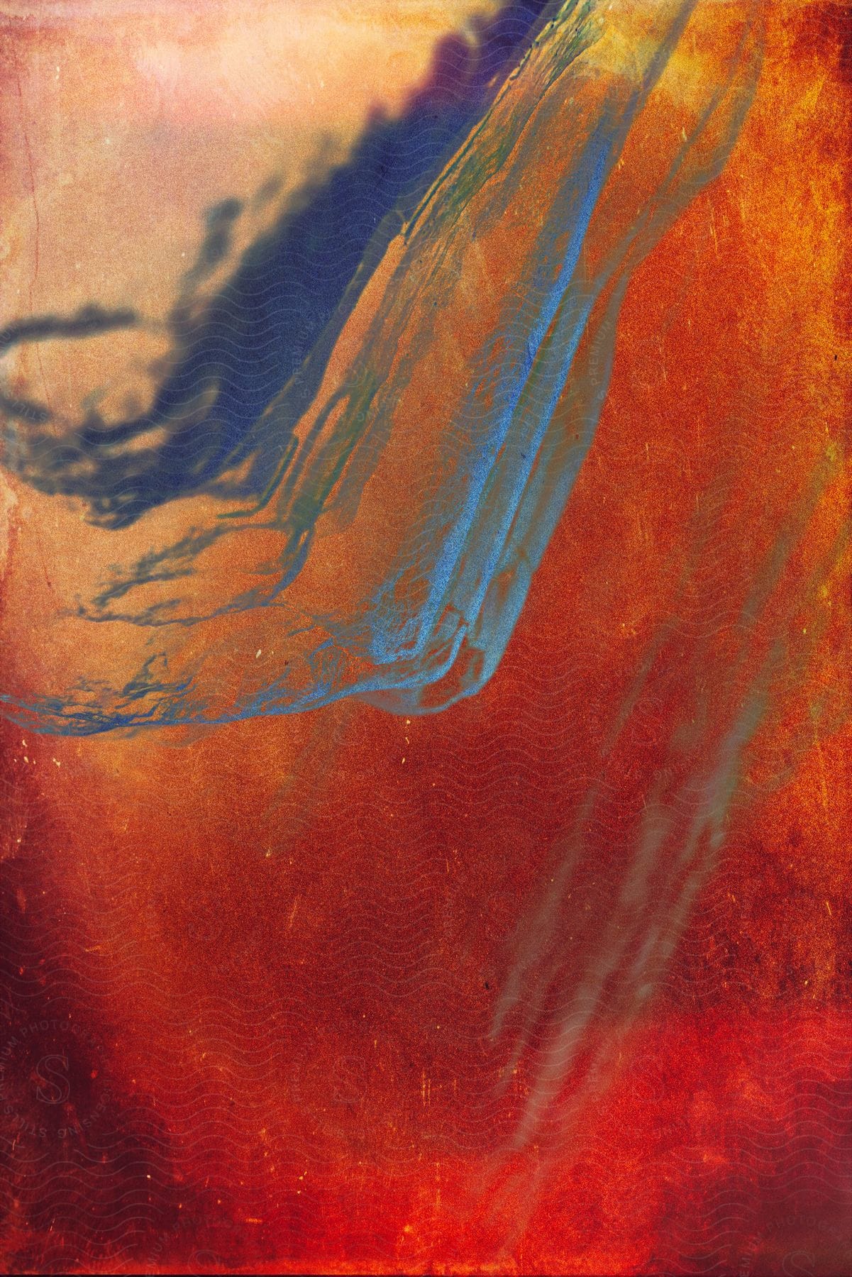 An Abstract Of A Reddish-orange Background With Light Blue And Dark Blue Paint Stripes