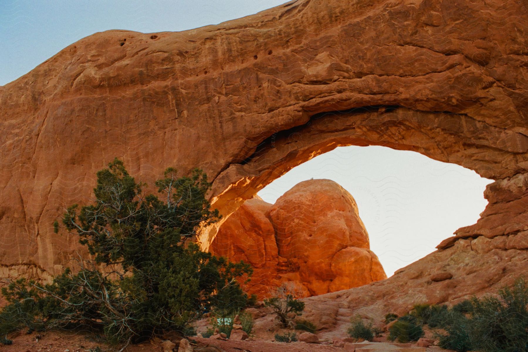 A rocky arch in the desert.