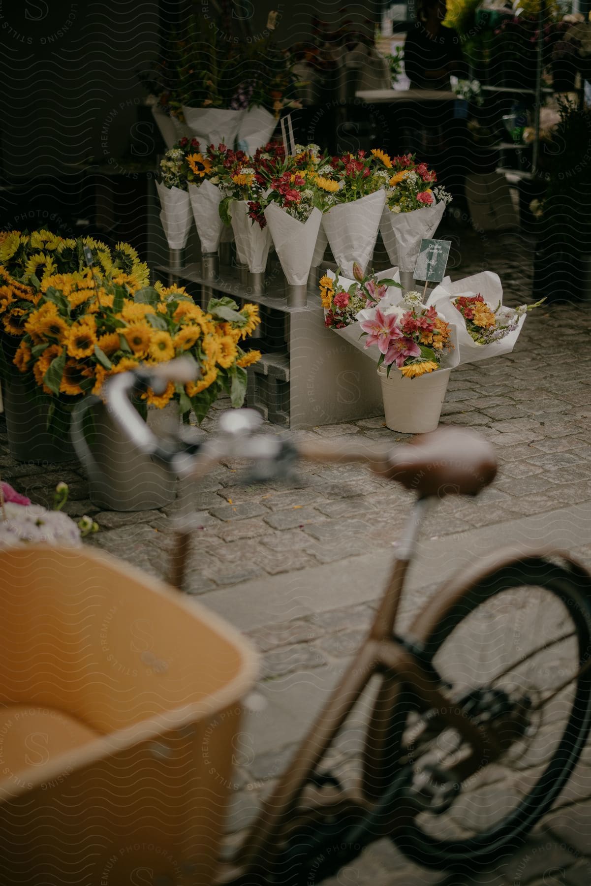 a bicycle is parked outside a flower shop