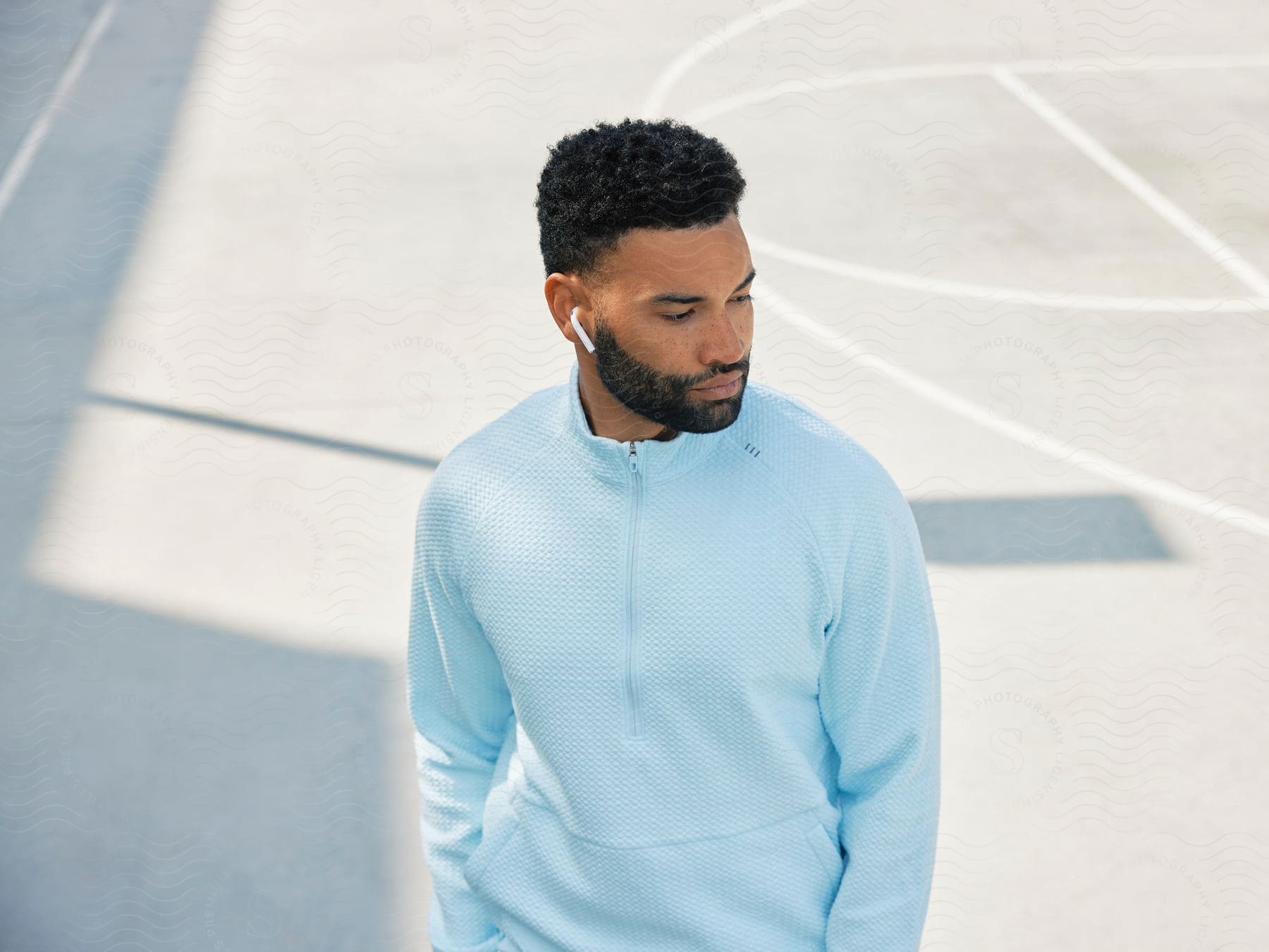 a man stands on a basketball court