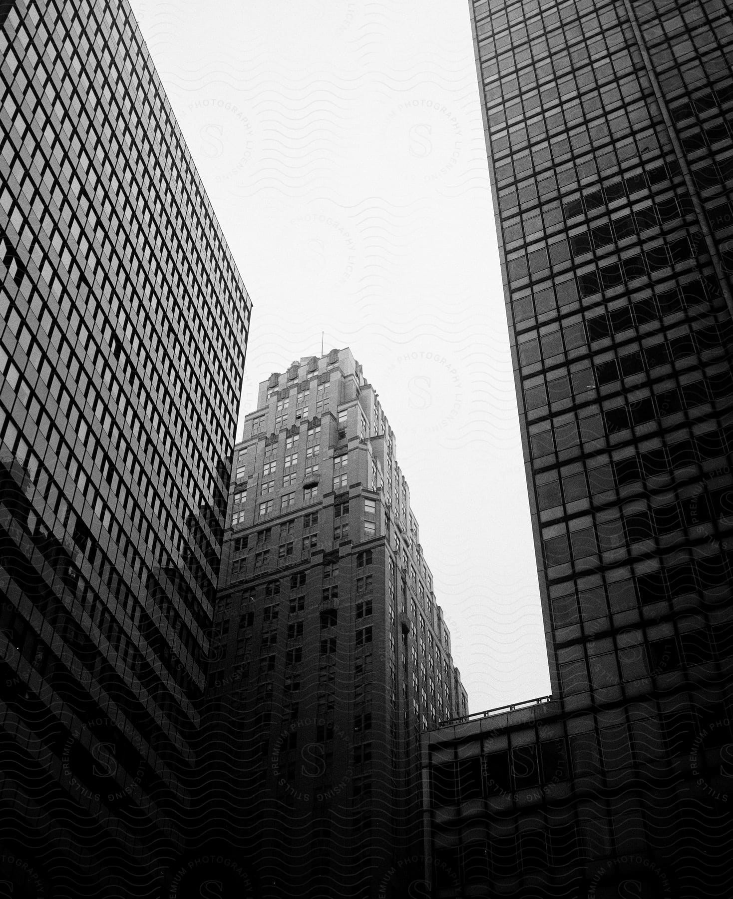 Downtown skyscrapers reflect nearby buildings.