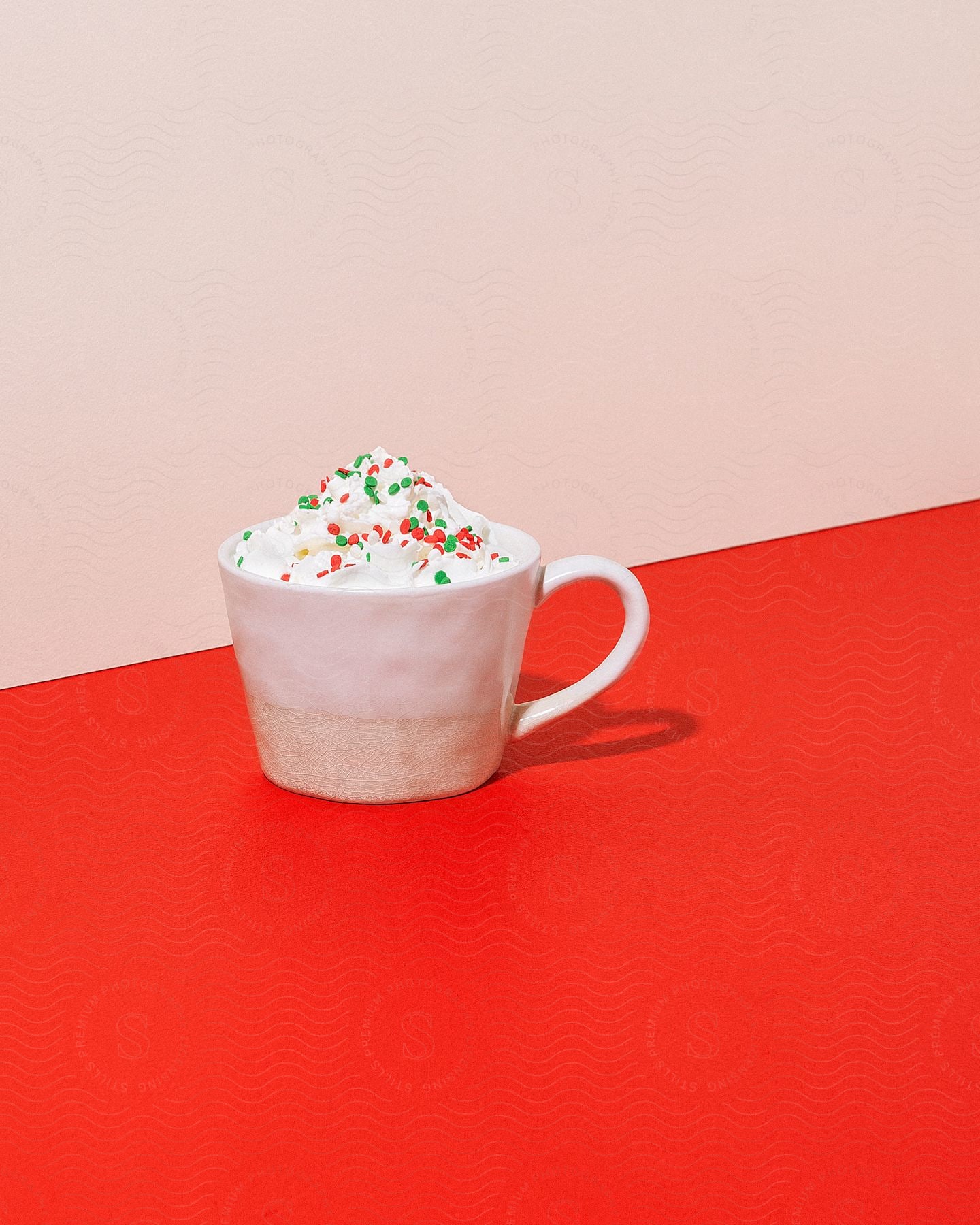 Hot chocolate in white cup on red background