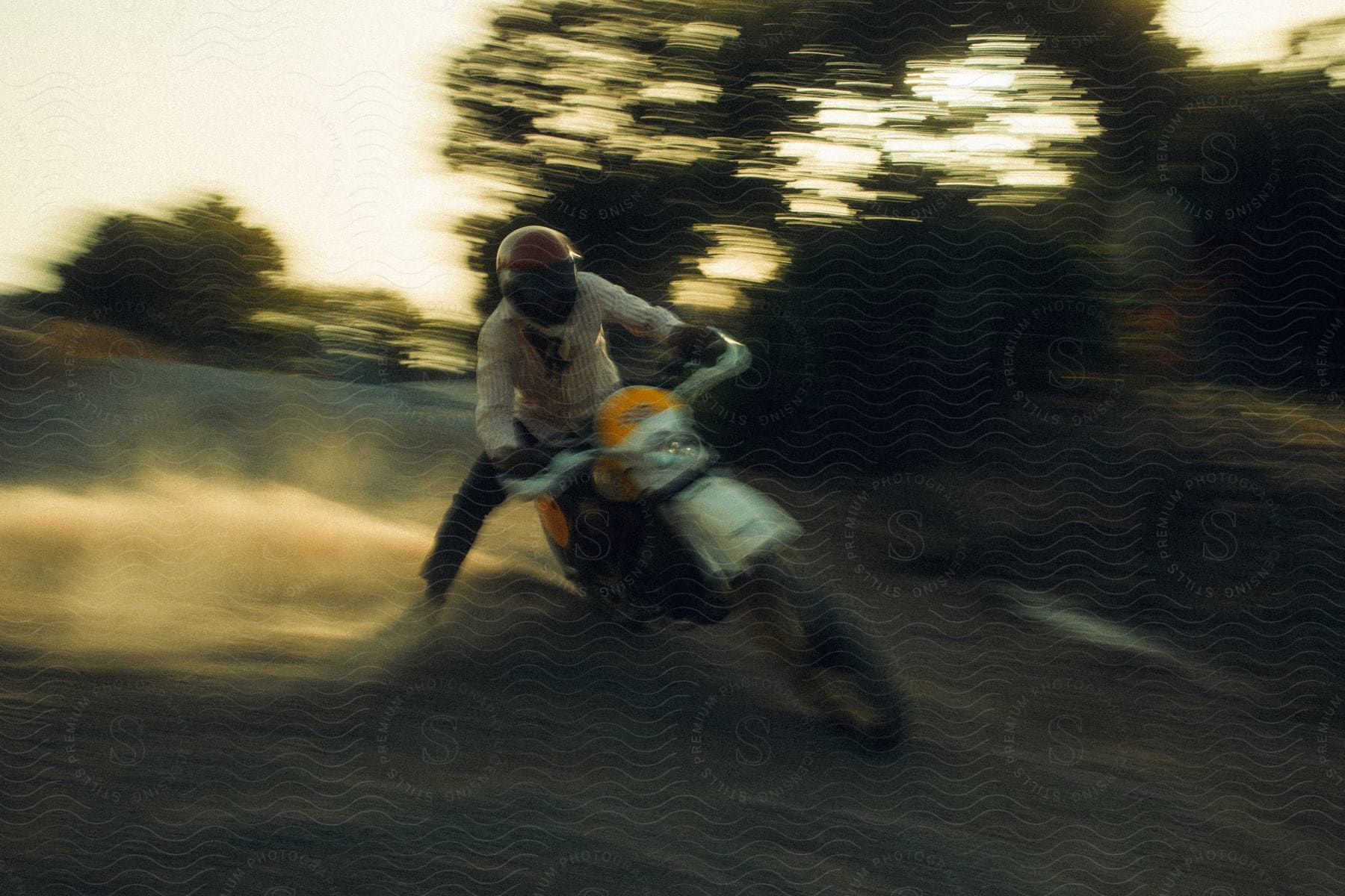 Man performing motocross tricks on his motorcycle.