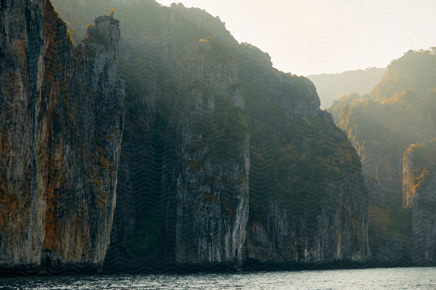 A view of some cliffs along the edge of the ocean.