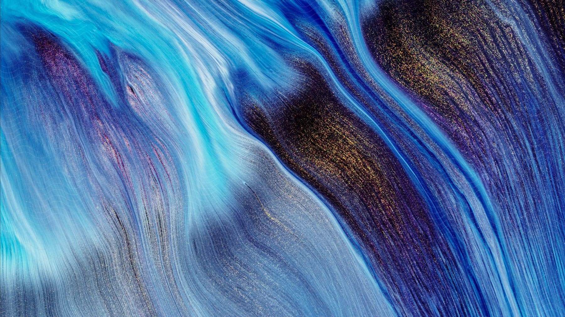 Abstract background of blue fluid ink flow on an abstract background.