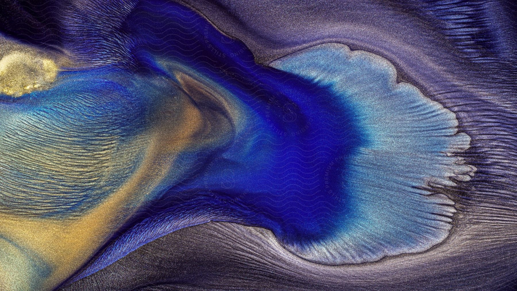 Abstract art of flowing and glossy fluid ink.