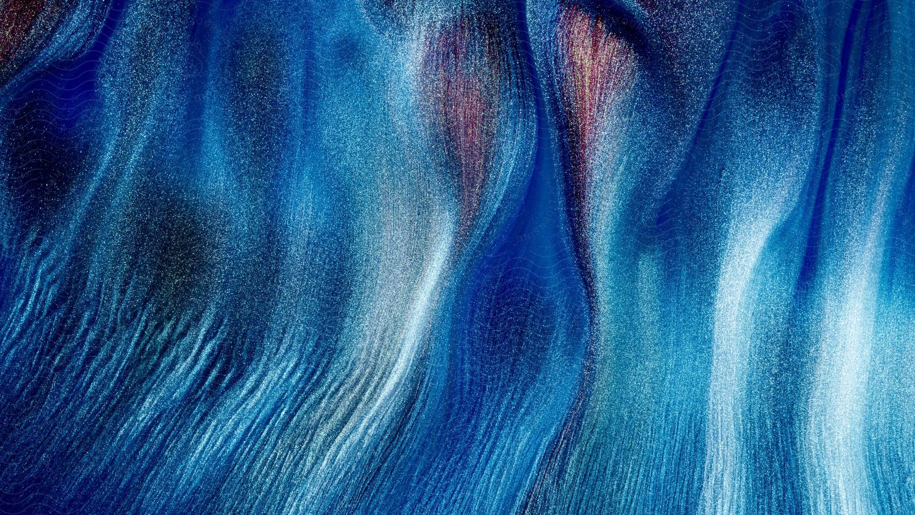 An abstract image with liquid blue shapes.