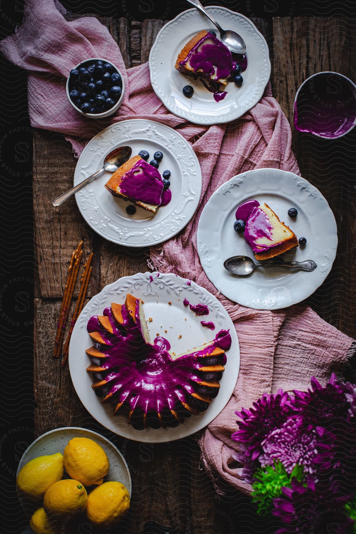 fruits and cakes in different plates on the kitchen table