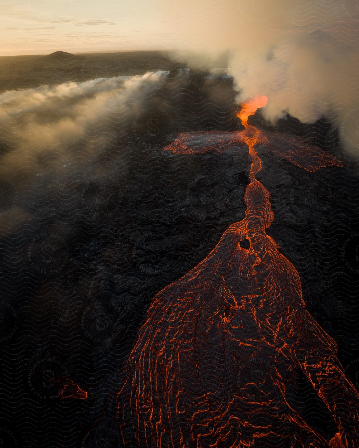 Path of lava, magma, and smoke from a volcano.
