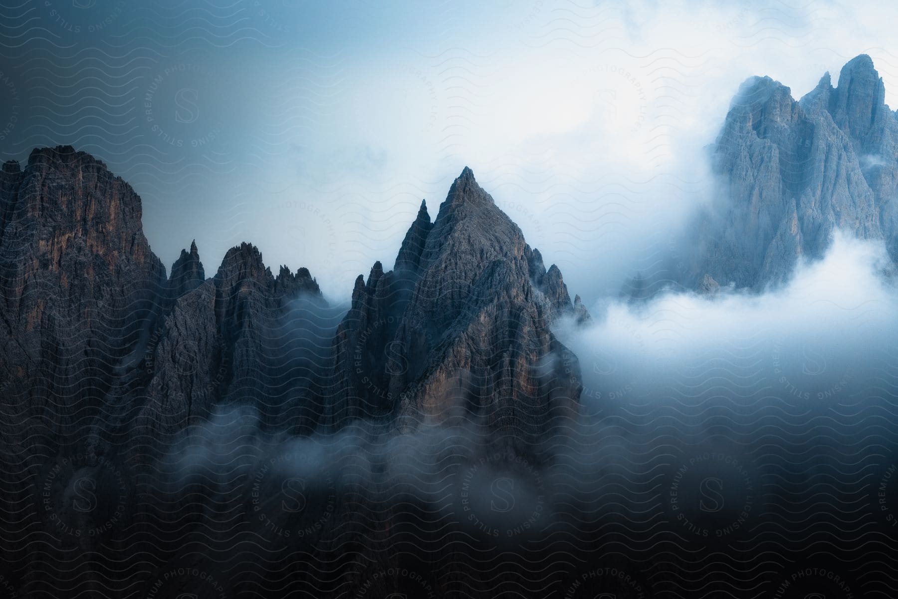 An aerial of a very steep mountain range on a cloudy day.